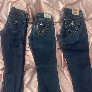 3 pairs of True Religion skinny dark blue jeans. One size 25 and two size 26.